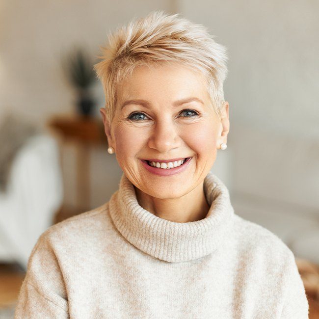 Woman smiling after sinus lift treatment