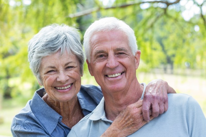 An older couple with dentures in Los Angeles smiling.